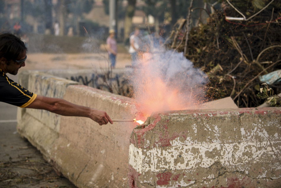 L'arribada de la Flama del Canigó a la Bisbal i encesa de la foguera de Sant Joan en imatges